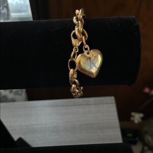Gold Heart Charm Bracelet with the initial K on it.